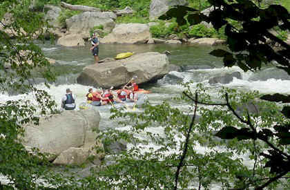 Rafters making their way through the rapids on the lower Yough.
